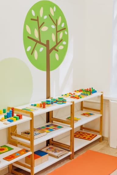 Bright, organized educational toys and materials on classroom shelves